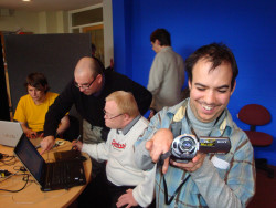 photo of a man holding a video camera